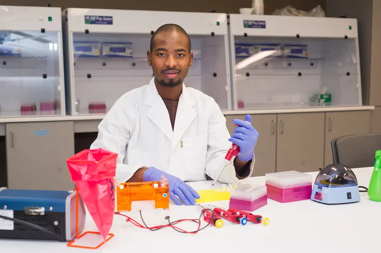 Student participating in lab research