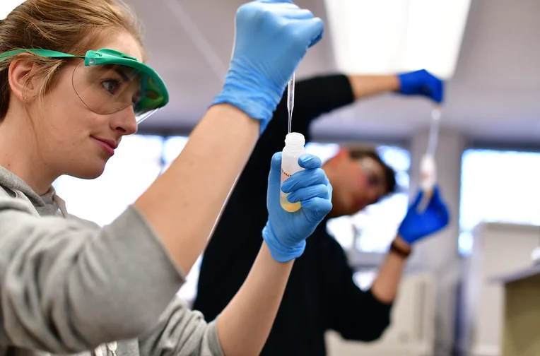 Students conducting experiment in Biochemistry class