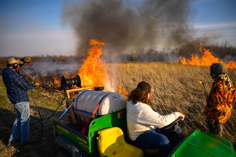 Students performing controlled burn at ESU's Ross Reservation