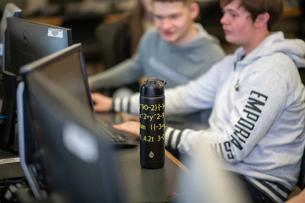 Students sitting at computer