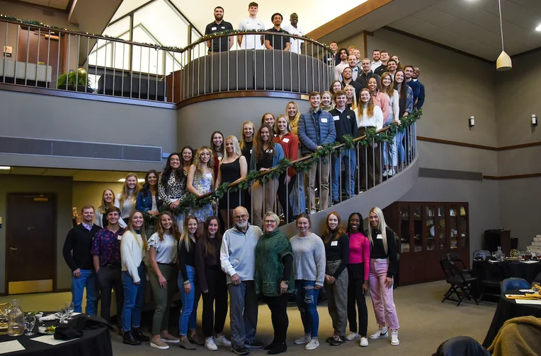 Group of scholarship students gather in Emporia State University's Sauder Alumni Center