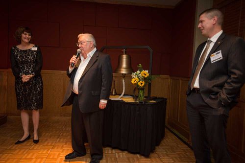 Richard “Dick” Hawk speaks after ringing the bell in celebration during an event at Hawk’s Gaslight Grill in Leawood, Kansas. With Hawk are Allison D. Garrett, ESU president, and Shane Shivley, president/CEO of the ESU Foundation and ESU vice president for advancement. 