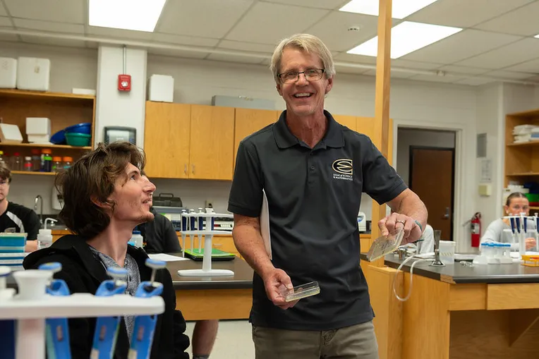 teacher working with student