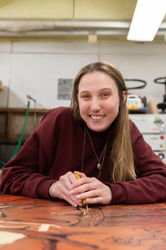 Student working on a printmaking project