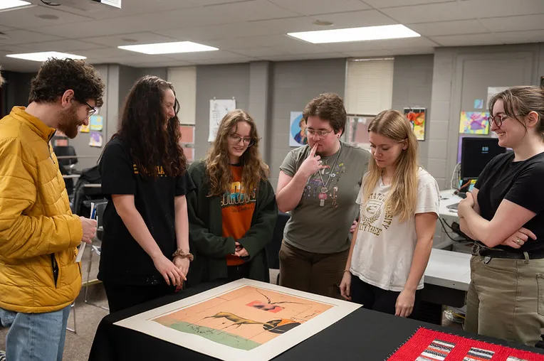 Students discussing art together