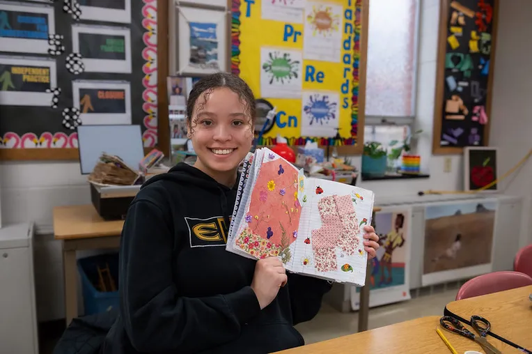 Student showing their art journal