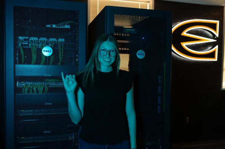 Student in CyROC giving stingers up