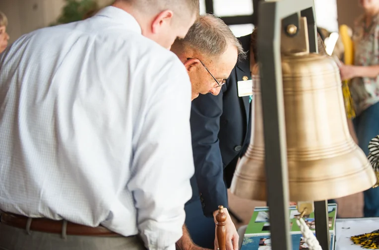 Alums ringing bell during donor ceremony