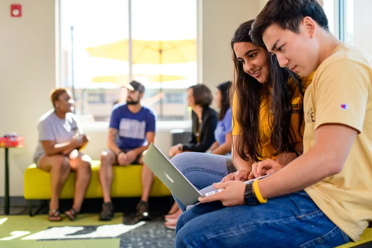 Emporia State students studying on laptop