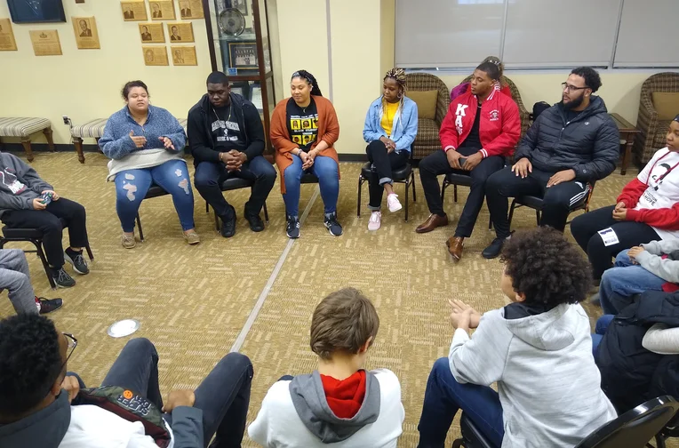 Students sitting in circle