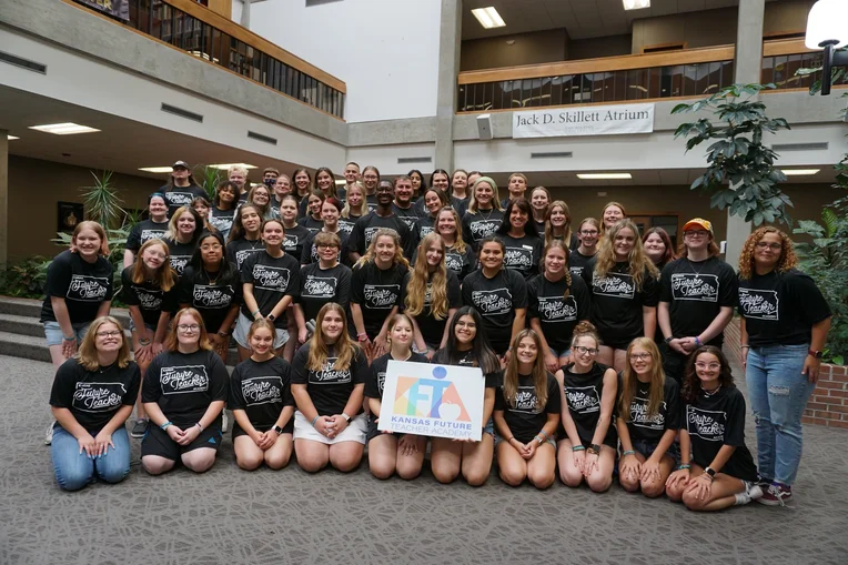 Group of students posing for photos from the Advanced Kansas Future Teacher Academy