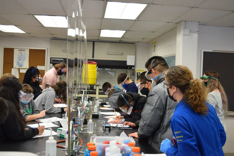 Students participating in science experiment