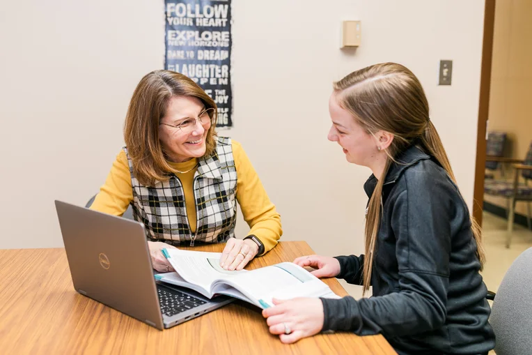 Student talking with professor