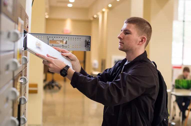 Library Student Checking out Laptop