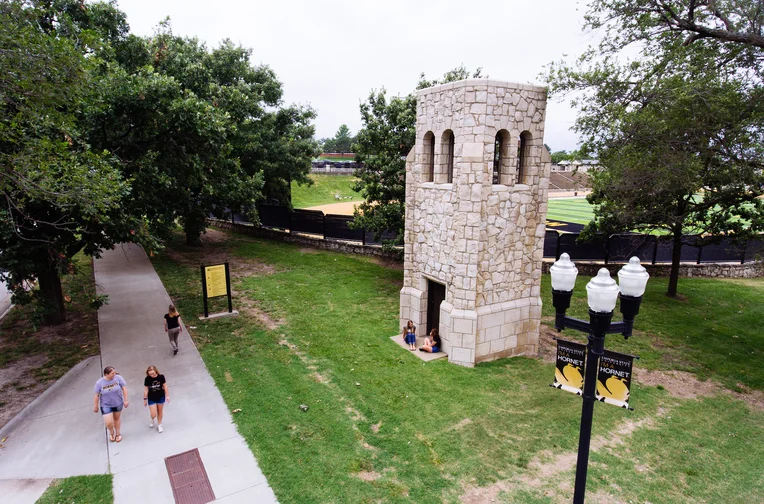 Emporia State students walking in front of Silent Joe