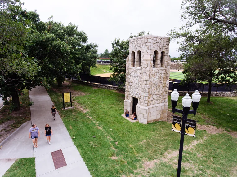 Emporia State students walking in front of Silent Joe