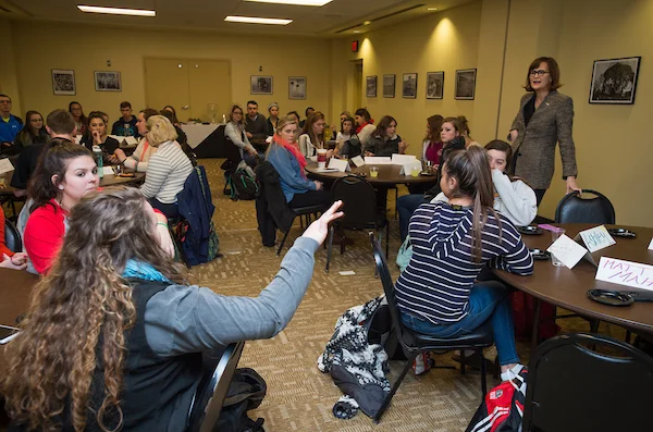 Students talking during roundtable discussion