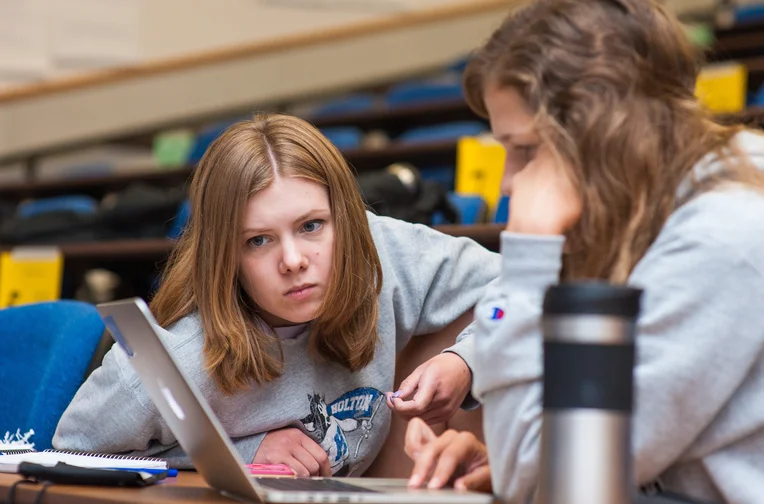 Emporia State students working on laptop together