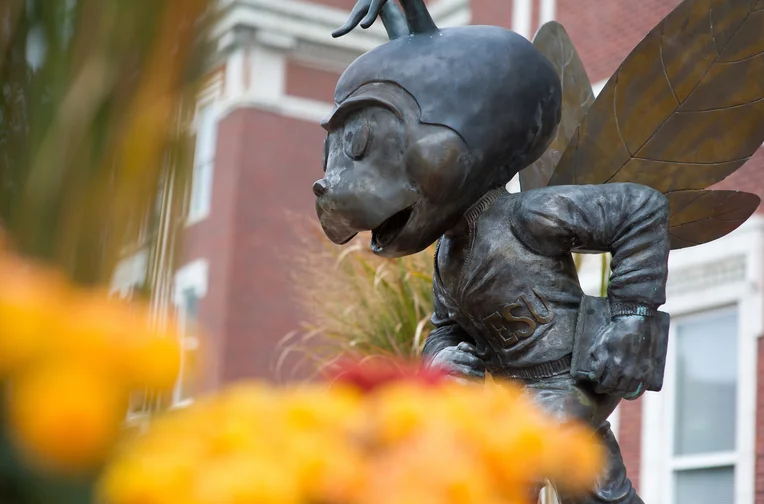 Emporia State mascot, Corky, in front of Plumb Hall