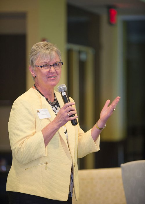 Dr. Jackie Vietti speaks to community members during a forum on campus.