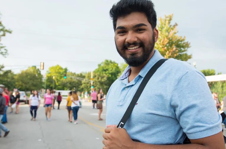 Student smiling in downtown Emporia