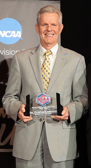 Man in suit holding an acrylic plaque