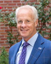 headshots of man with short gray hair wearing blue jacket